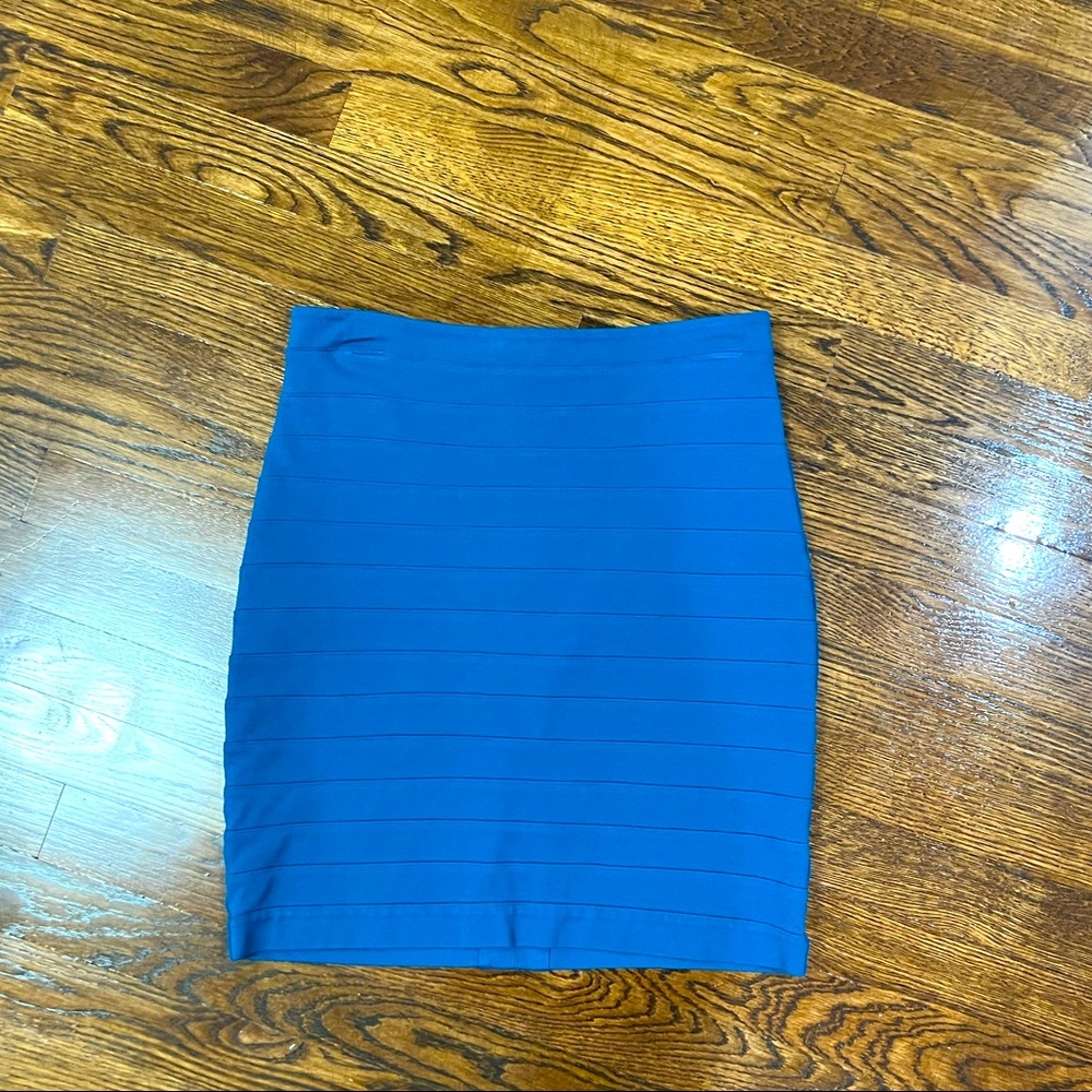 Teal pencil skirt with zip enclosure on the back